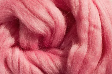 Fotobehang Pink wool for felting close-up © Ольга Никифорова