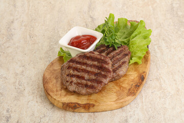 Grilled beef burger cutlet with sauce