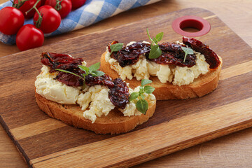 Bruschetta with soft cheese and tomato