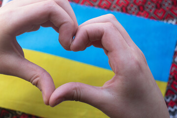 Ukraine love concept. hands in the shape of a heart on the background of the flag of Ukraine - yellow and blue. Ukraine Independence Day, Flag, Constitution Day