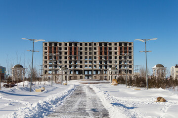 Uralsk, Kazakhstan (Qazaqstan), 12.03.2022 - Hotel building under construction in the city of Uralsk, new building, construction, Nursultan Nazarbayev Square
