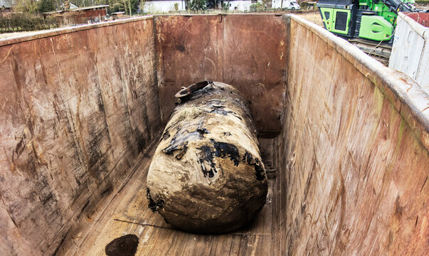 Soil tank excavated during soil remediation is temporarily stored in an iron container for further proper disposal