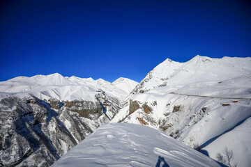 The Caucasus Mountains is a mountain range at the intersection of Asia and Europe. Stretching between the Black Sea and the Caspian Sea