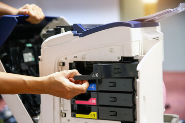 Technician hand open cover photocopier or photocopy to fix paper jam and replace ink cartridges for...