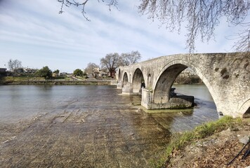 Fototapeta premium bridge arched in arta city on arahthos river in greece