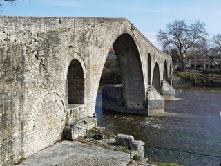 Fototapeta na wymiar bridge arched in arta city on arahthos river in greece