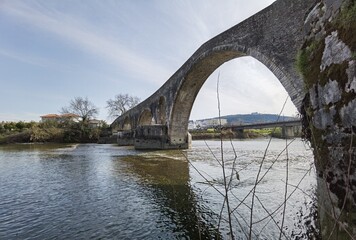 Fototapeta na wymiar bridge arched in arta city on arahthos river in greece
