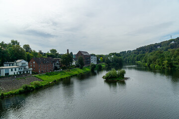 Small village near to the river and cloudy sky