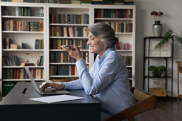 Older generation using modern tech, comfort communication, ai, workflow concept. Mature 60s...