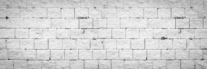 Obraz premium Abstract white brick wall texture light gray old stucco and vintage brickwork pattern background in home interior, grunge rusty blocks of stonework grey color panoramic wide wallpaper