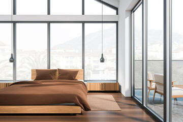 Front view on bright bedroom interior with bed, panoramic window