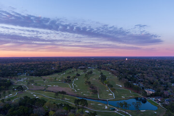 sunset over the country club golf course 