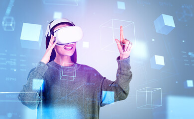 Businesswoman is wearing vr helmet and touching geometrical figu