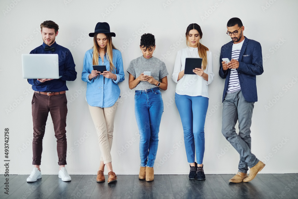 Leinwandbilder it was bring your device day today. shot of a group of creative employees using wireless technology 