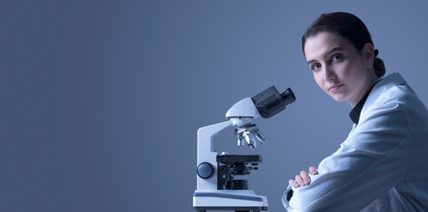 Young researcher posing and looking at camera