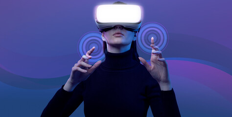 Woman wearing a VR headset and interacting with virtual reality