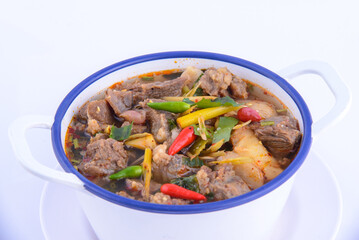 Thai favorite food. Spicy chicken soup (Tom Yum Gai Baan) in the white bowl.