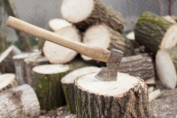 Chopping wood to heat a house in Ukraine at war with Russia