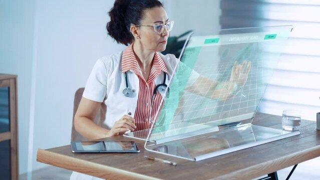 Medical female doctor scientist working at  digital futuristic computer. Transparent display with 3D Hologram DNA data.