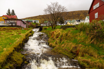 Fototapeta na wymiar Small port town in rainy day, Vestmanna, Faroe Islands.