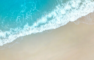 Aerial top view of  tropical beach with the transparent Caribbean sea and the blue sky in the background