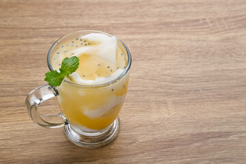 Es Kelapa Jeruk, a typical Indonesian drink made from fresh oranges squeezed with grated young coconut.
