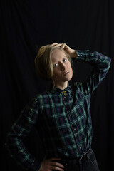 Ukrainian young blonde woman with a pendant with the state emblem of Ukraine - Trident close up. Russia attacked Ukraine on February 24, 2022