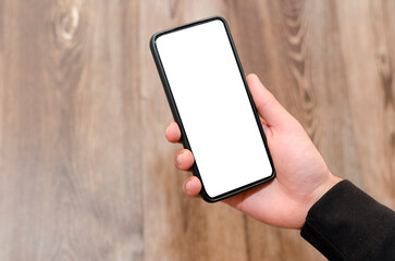 Man holding mobile phone with empty blank screen in hand 