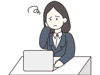 困り顔でパソコンをする女性　ビジネス　スーツ　人物