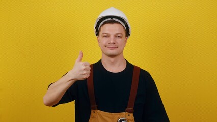 The concept of successful construction. Worker in uniform showing ok