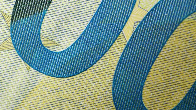 Paper money, euro, fiat money. Stop motion, macro view of parts of banknotes as a financial background. Light zoom. Financial and business success as a concept. Currency cash animation.