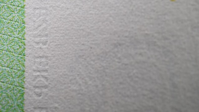 Paper money, euro, fiat money. Stop motion, macro view of parts of banknotes as a financial background. Light zoom. Financial and business success as a concept. Currency cash animation.