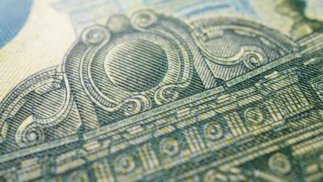 Paper money, euro, fiat money. Stop motion, macro view of parts of banknotes as a financial background. Light zoom. Financial and business success as a concept. Currency cash animation.