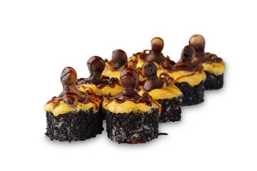 baked sushi roll with octopus, tobiko black caviar, cheese and unagi sauce. Isolated on white background