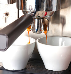 espresso machine pouring coffee on the table