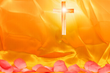 golden yellow silk with Christian cross and ink petals at bottom as background