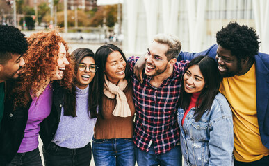 Young diverse people having fun outdoor laughing together - Diversity concept - Main focus on gay man face