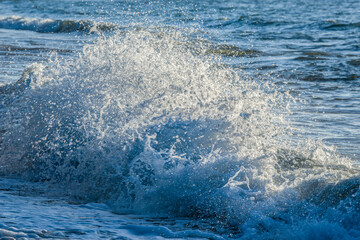 Waves splashing at sunrise