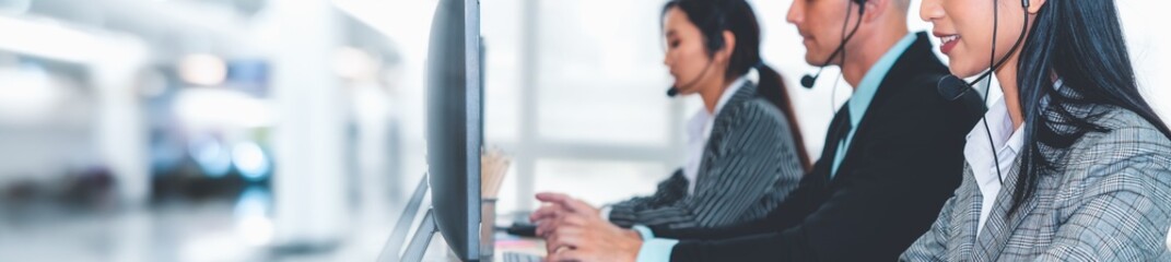Call center or customer support agent in broaden view panorama banner wearing headset while working...