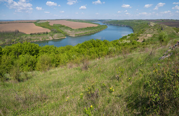 Amazing spring view on the Dnister River Canyon with picturesque rocks, fields, flowers. This place named Shyshkovi Gorby,  Nahoriany, Chernivtsi region, Ukraine.