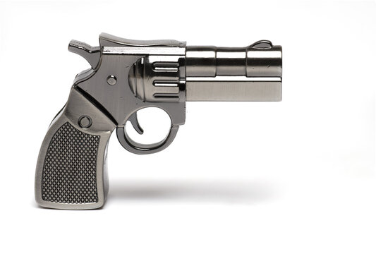 Closeup toy gun revolver shadow white background