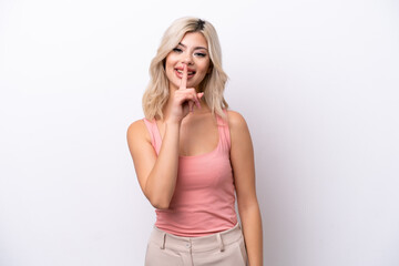 Young Russian woman isolated on white background showing a sign of silence gesture putting finger in mouth