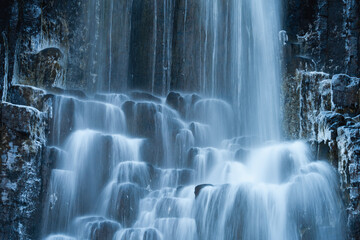 Long exposure of waterfall over the icy wall - Powered by Adobe