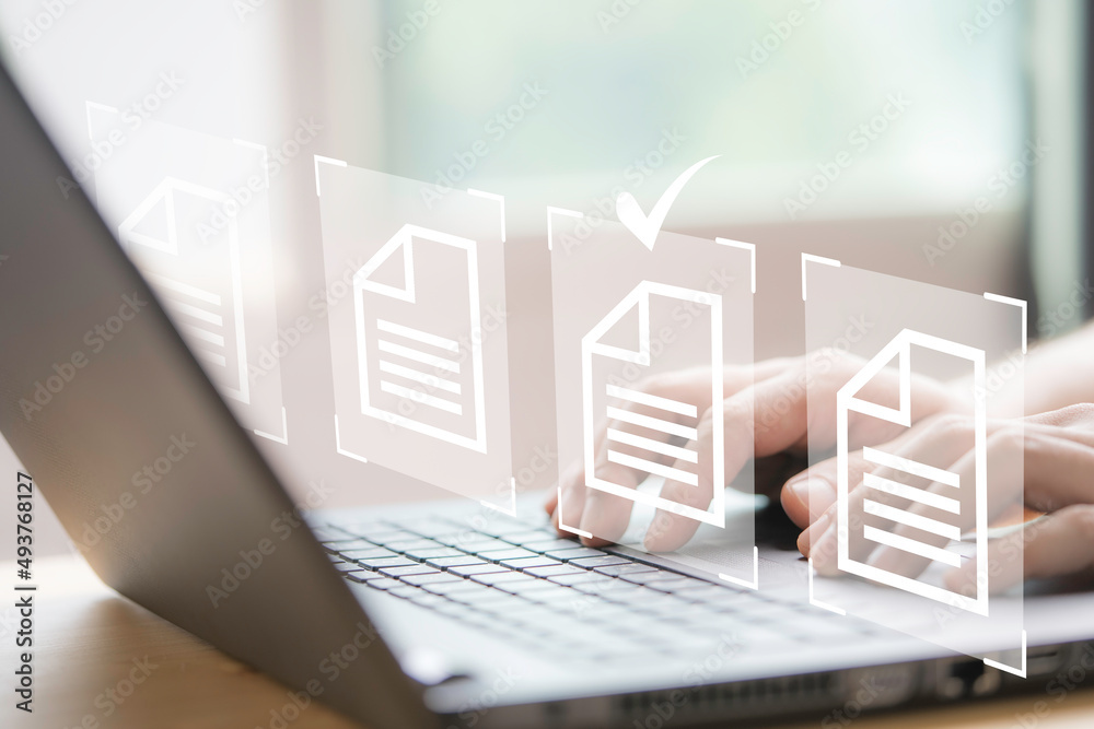 Aufkleber Hand using laptop computer with virtual screen and document for online approve paperless quality assurance and ERP management concept.