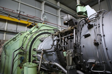 Fototapeta premium Gas transportation system. Booster pumping station for gas. Gas filling station and gas tanks. Transportation of gas around the world. Oil and gas sector. Gas turbines.