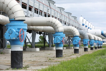 Gas transportation system. Booster pumping station for gas. Gas filling station and gas tanks. Transportation of gas around the world. Oil and gas sector. Gas turbines.