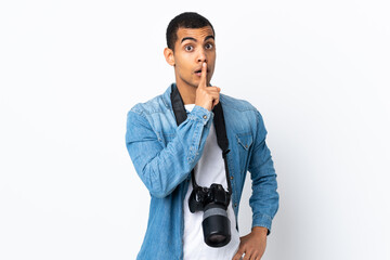 Young African American photographer man over isolated white background doing silence gesture