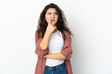 Teenager Russian girl isolated on white background nervous and scared