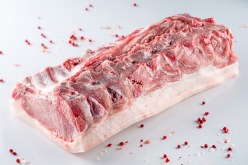 pork brisket on a bone. A piece of raw meat on a white background.