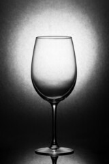 Empty glass of wine focus in dark background